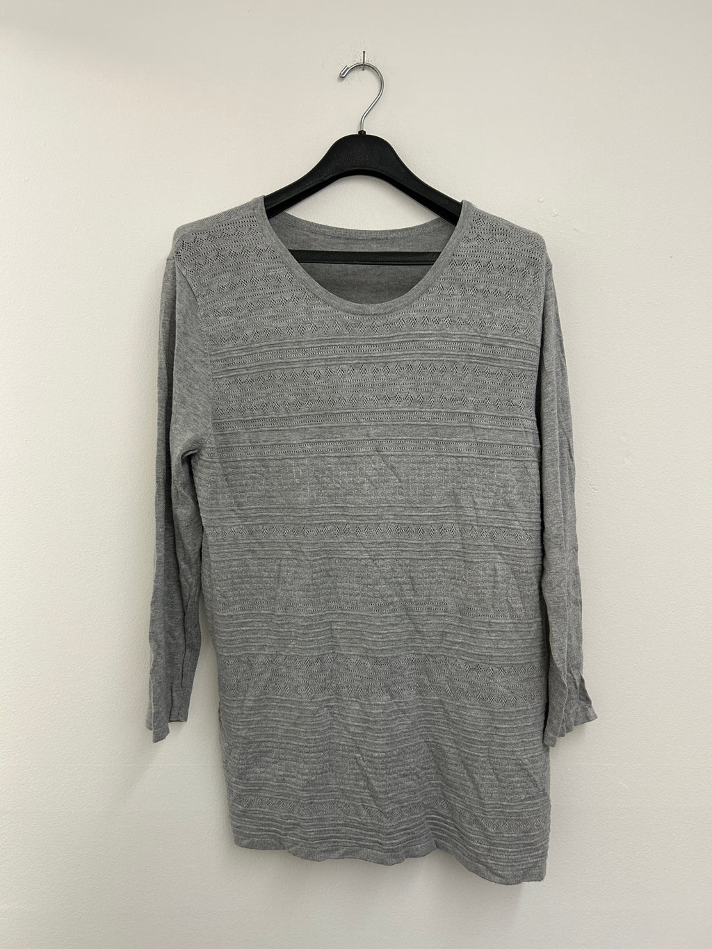 Lightweight gray sweater with textured patterns