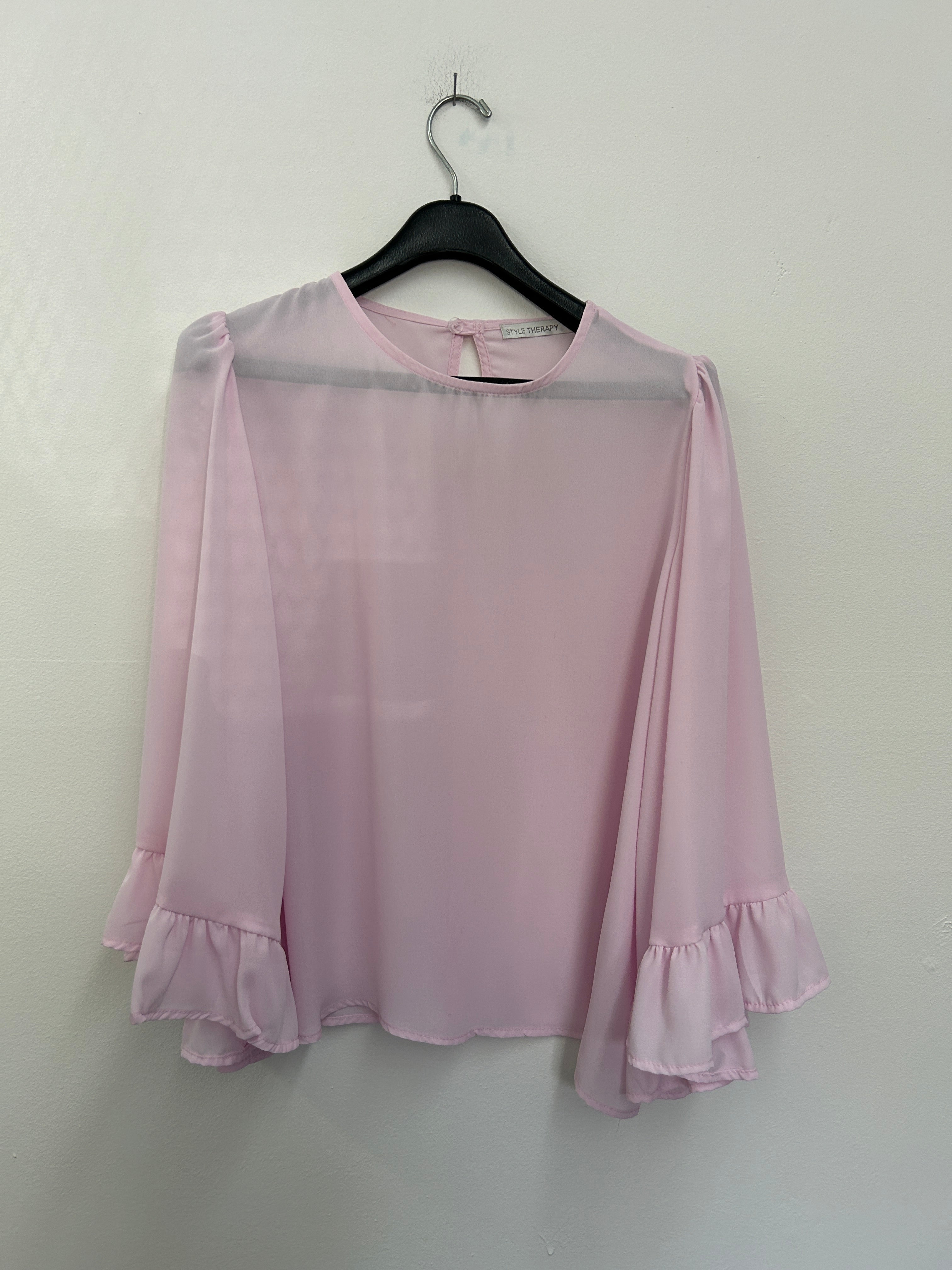 Blouse rose pâle à manches évasées