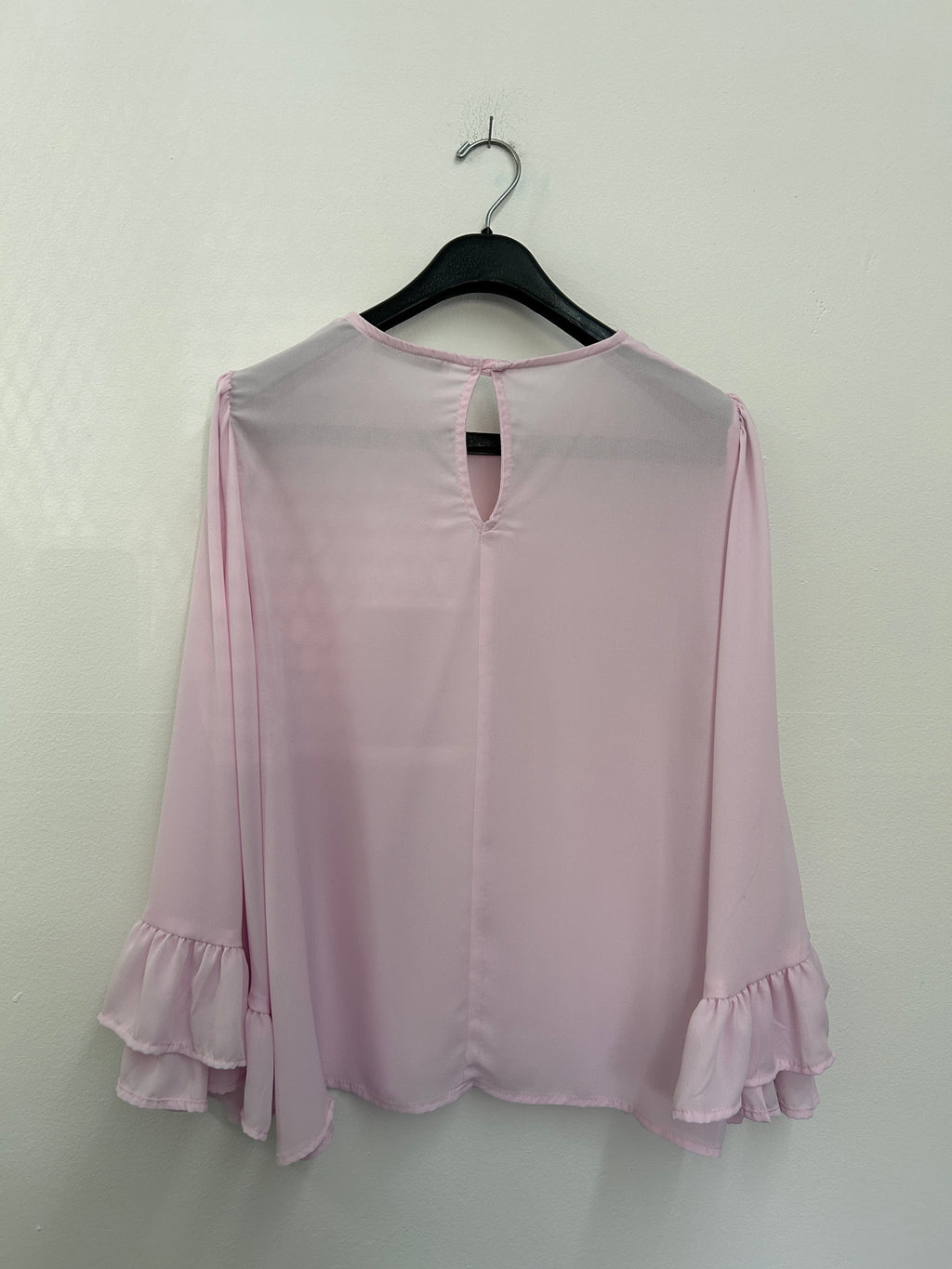 Blouse rose pâle à manches évasées
