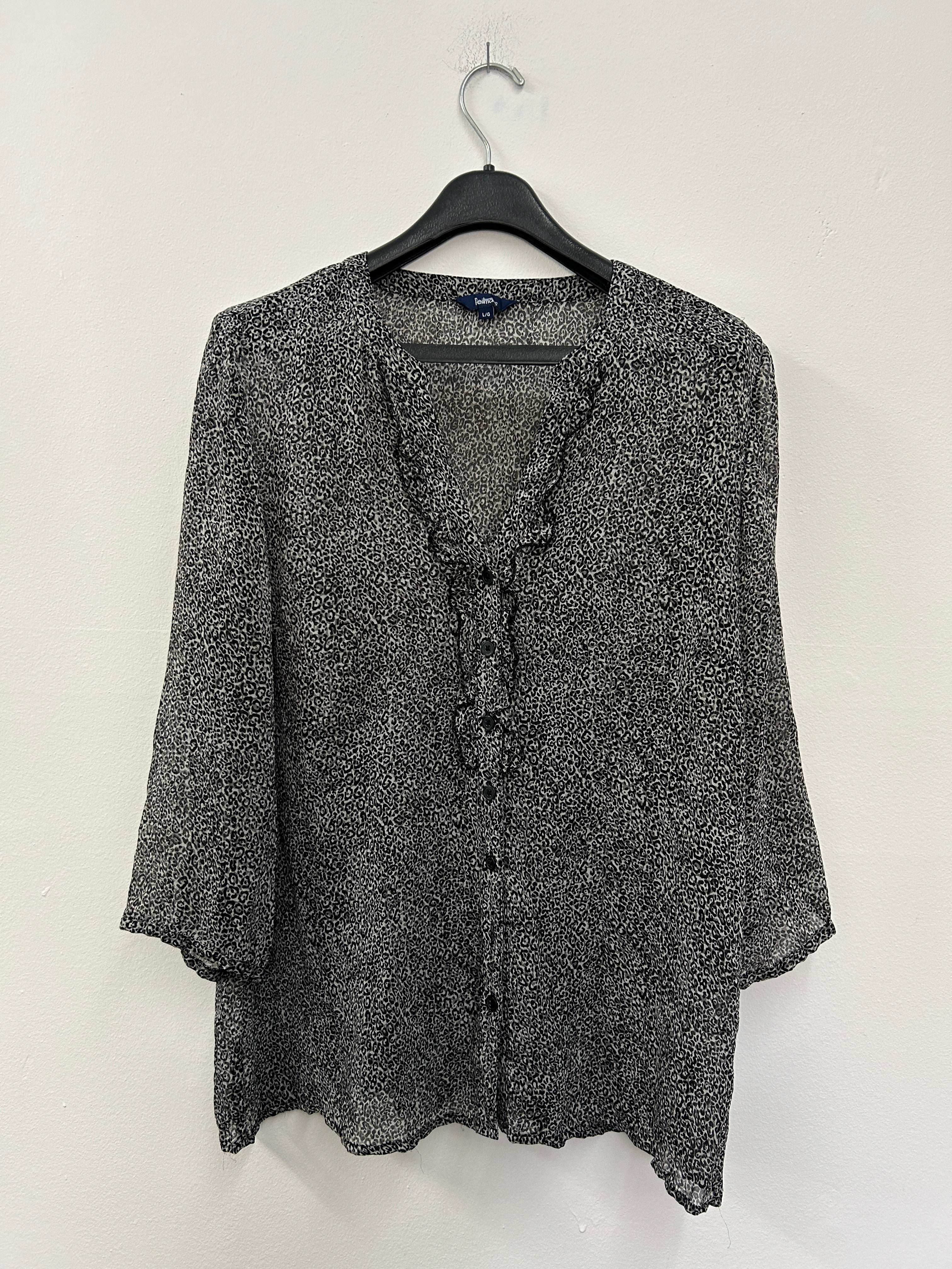 Chemise blouse léopard avec une texture mince transparent