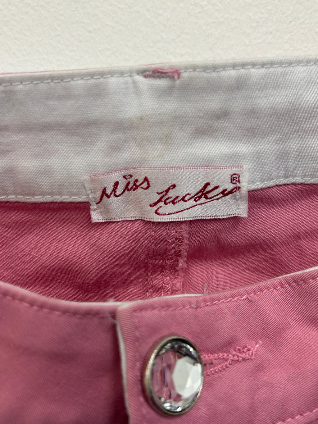 Pantalon rose à fleurs perlées