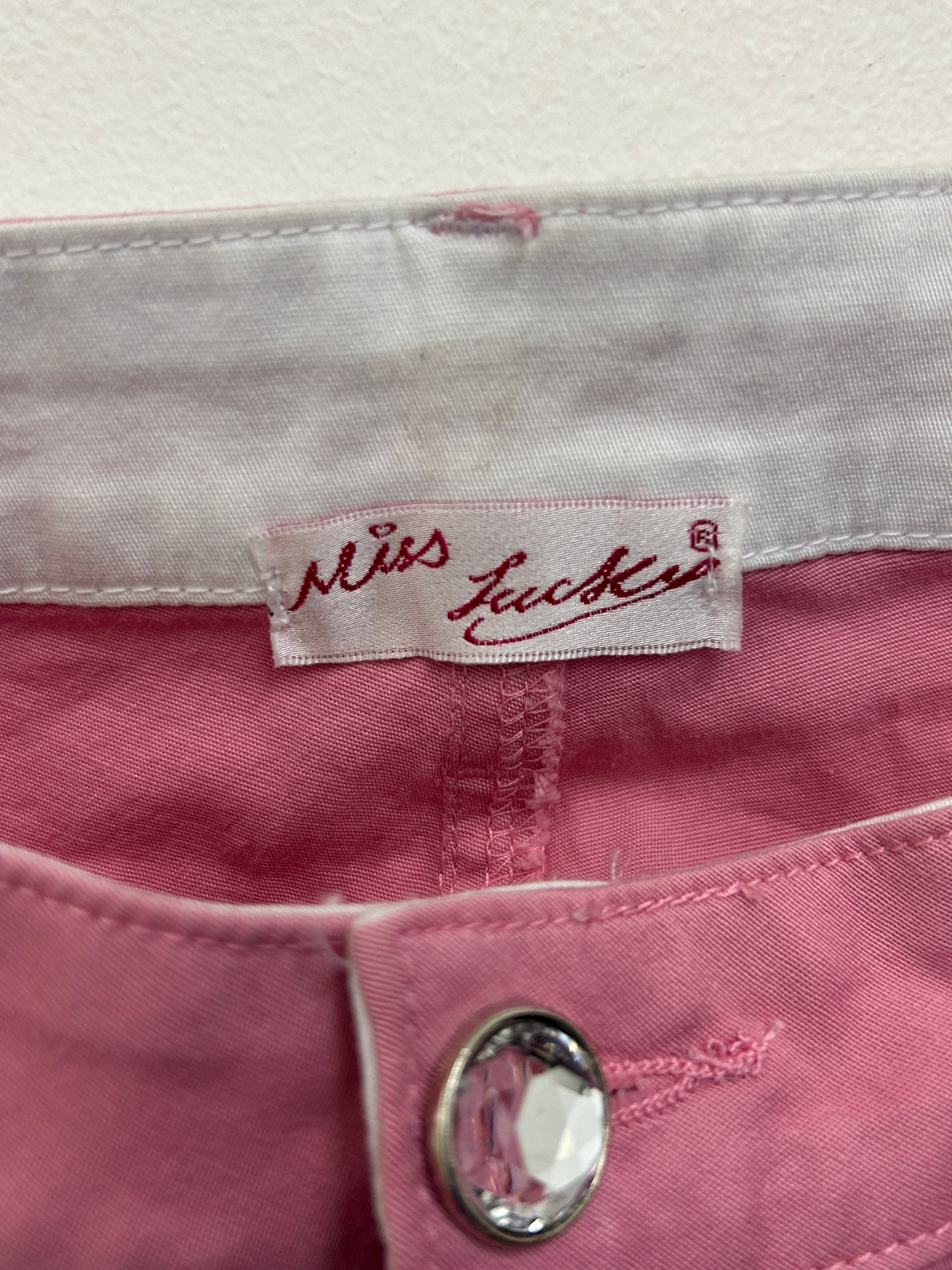 Pantalon rose à fleurs perlées