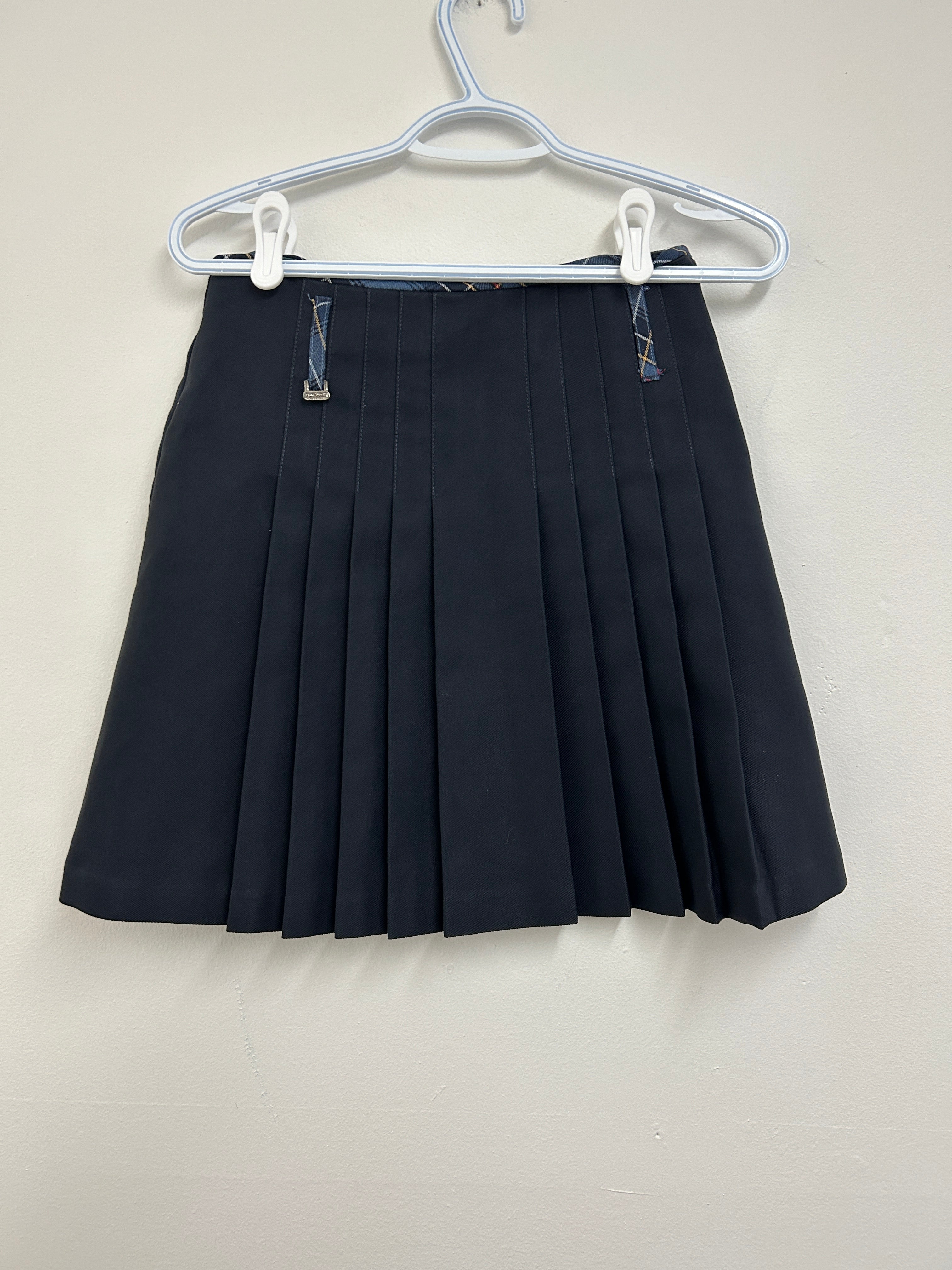 Jupe plissée noire avec poches arrière