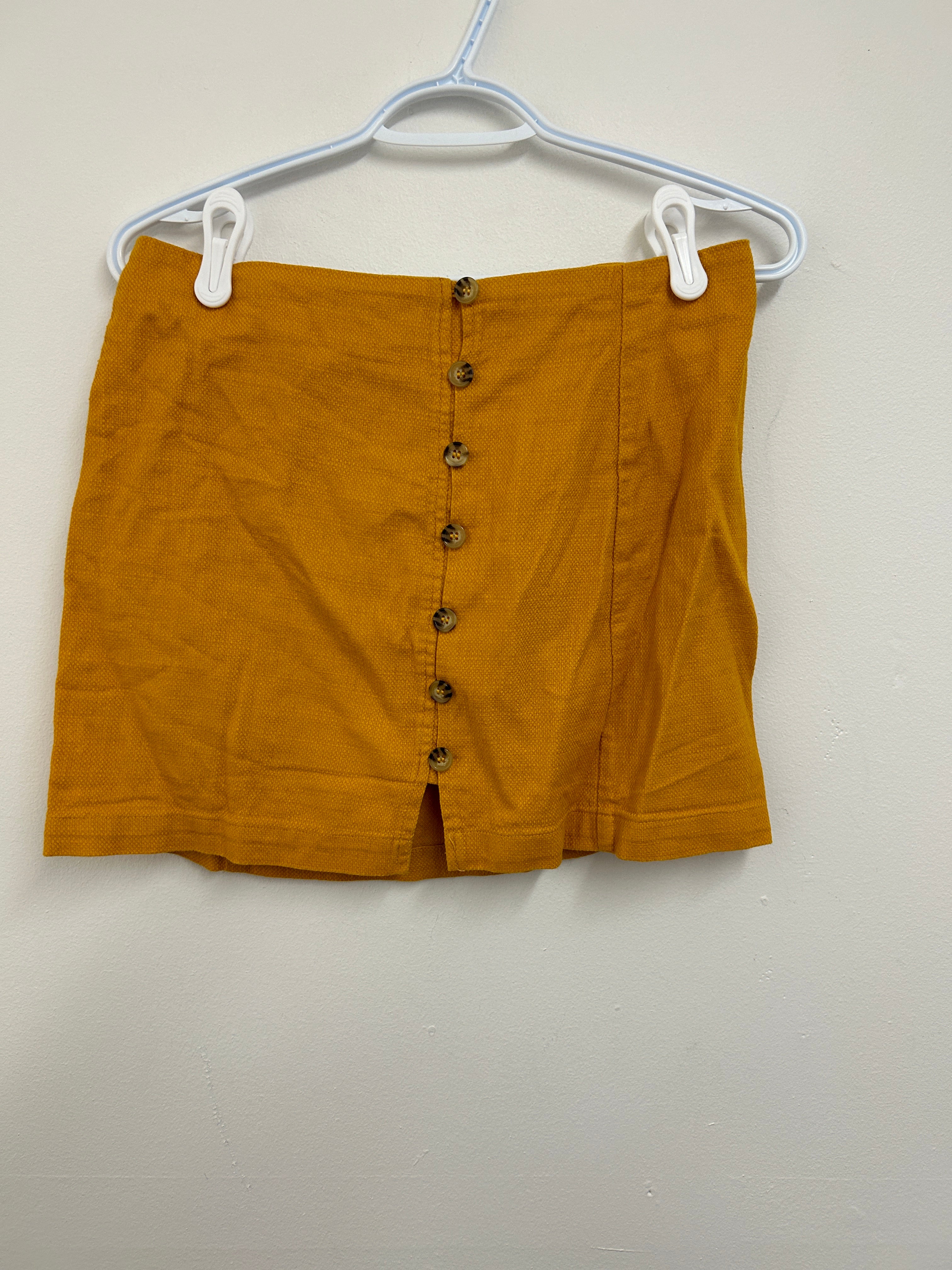 Jupe courte boutonnée jaune moutarde