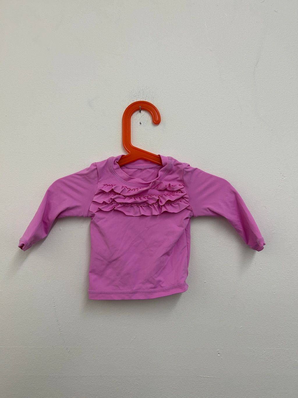 Haut à volants rose — Tag