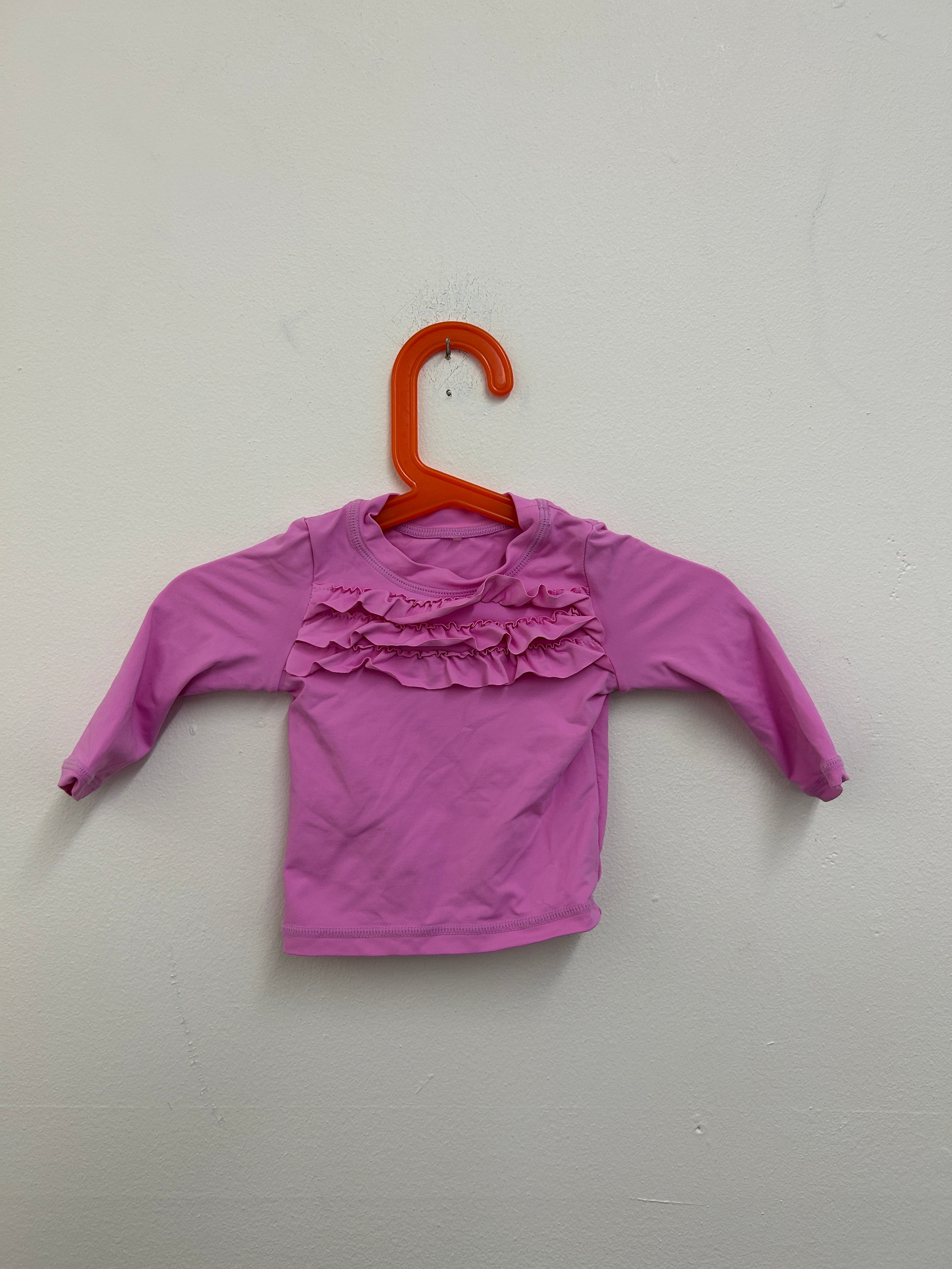 Haut à volants rose — Tag