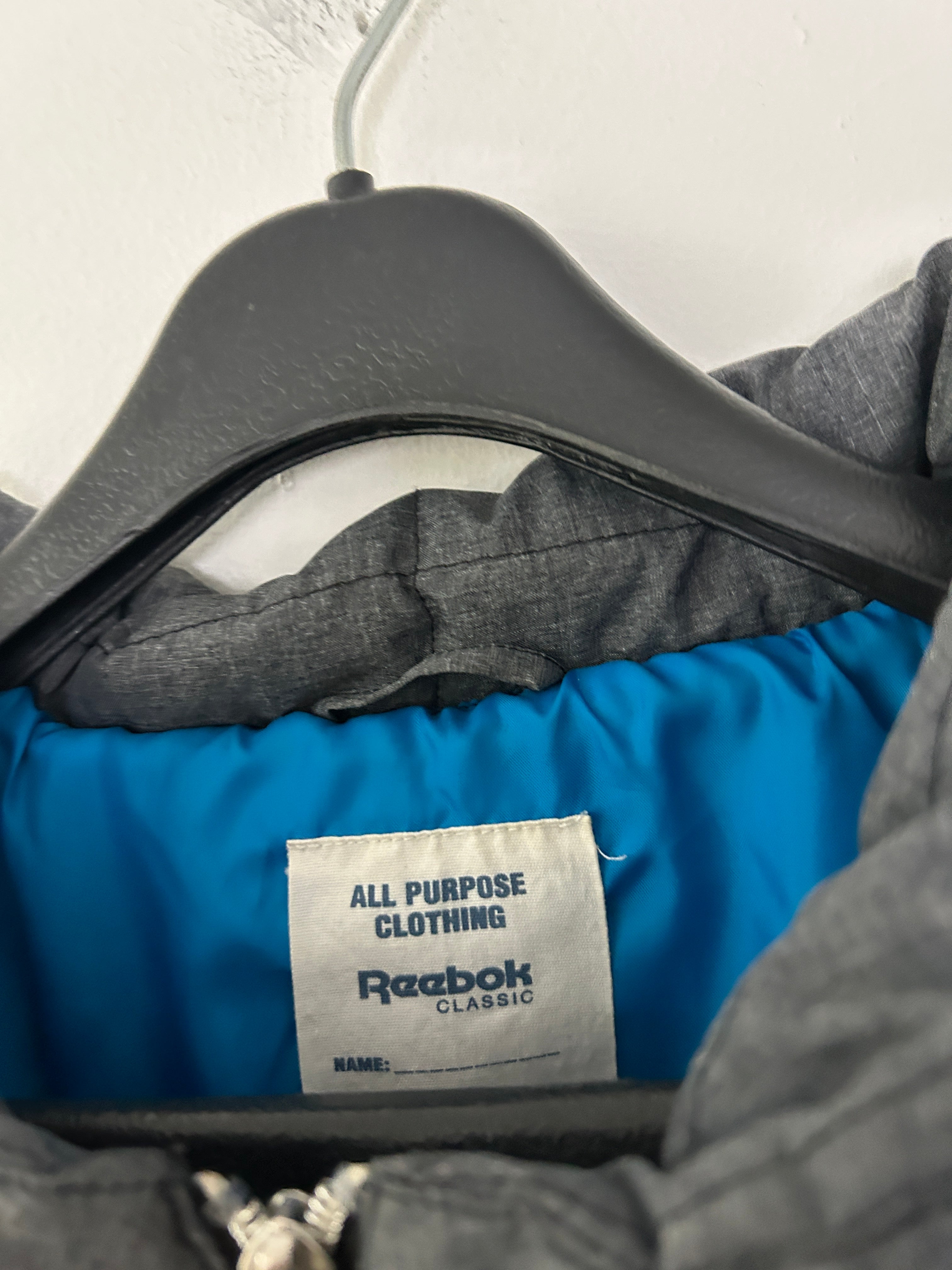 Manteau matelassé gris à capuche — Reebok