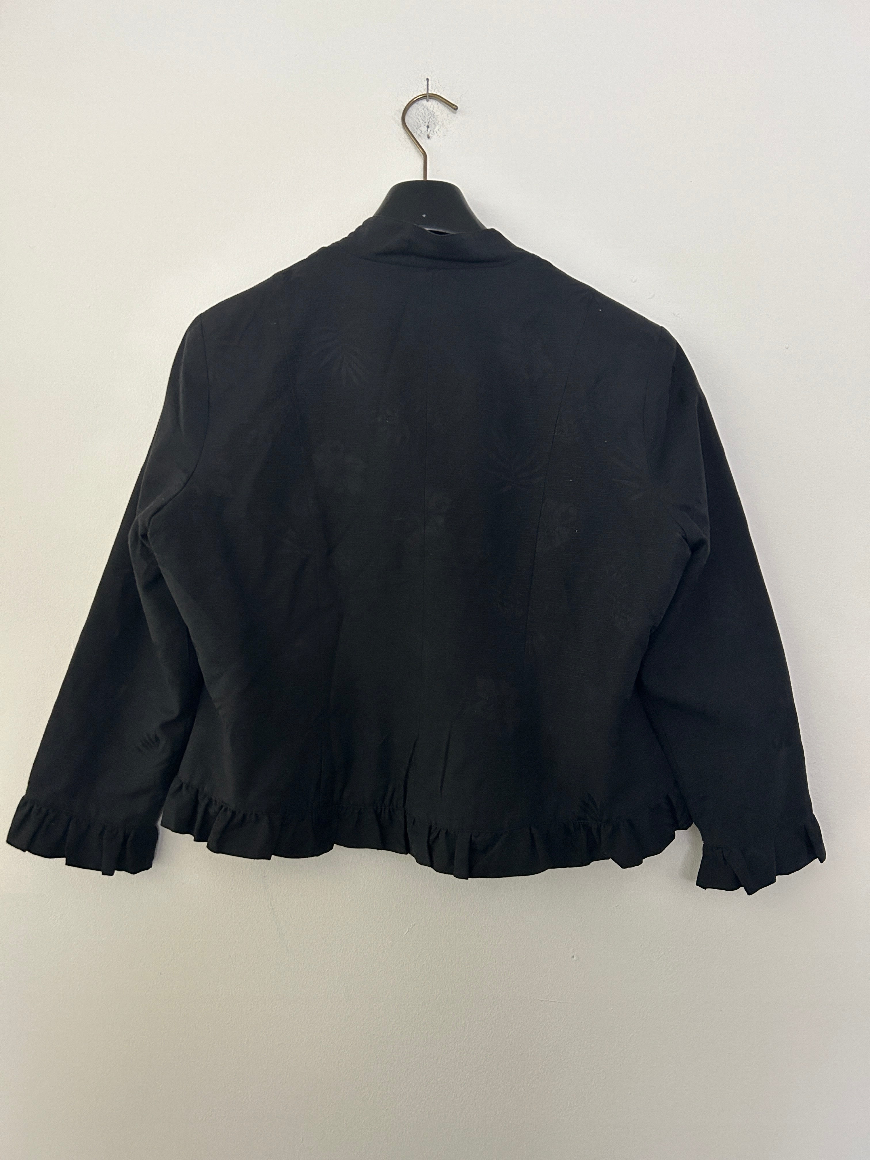 Veste noire volantée – Anne Carson